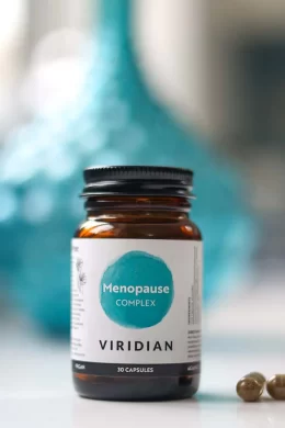 viridian menopause tablets jar with blue background